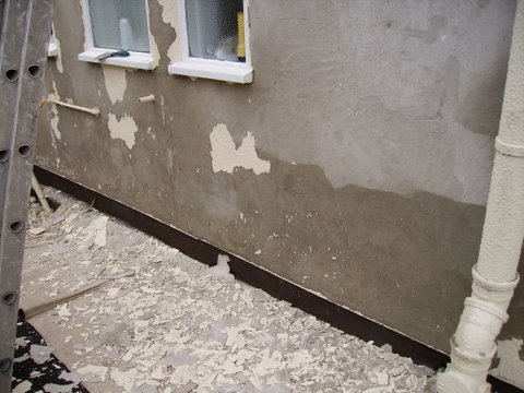 paint flaked off because of damp in walls