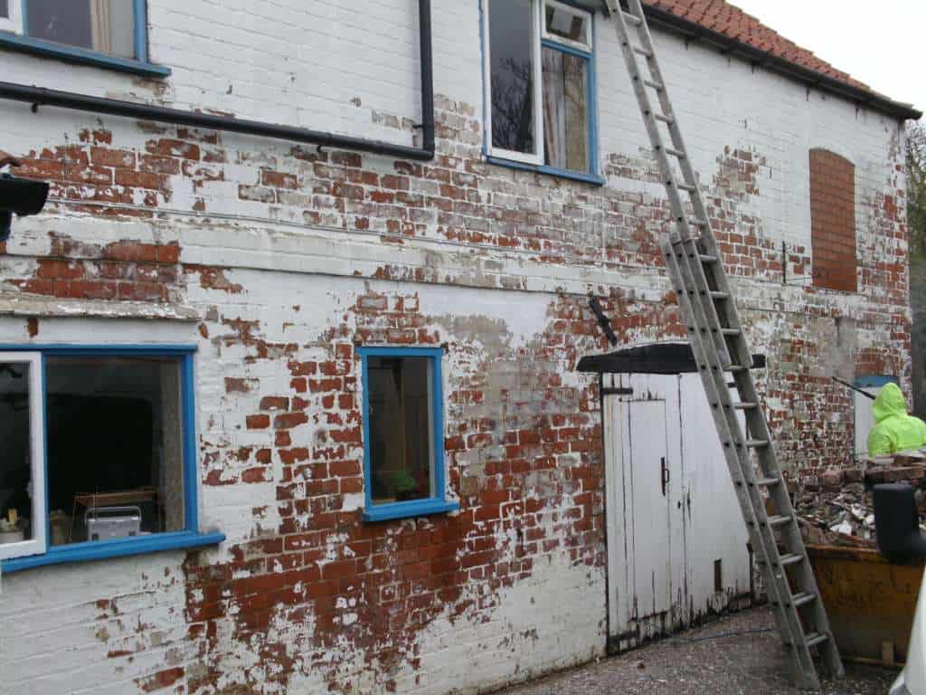 Painted brick in very poor condition