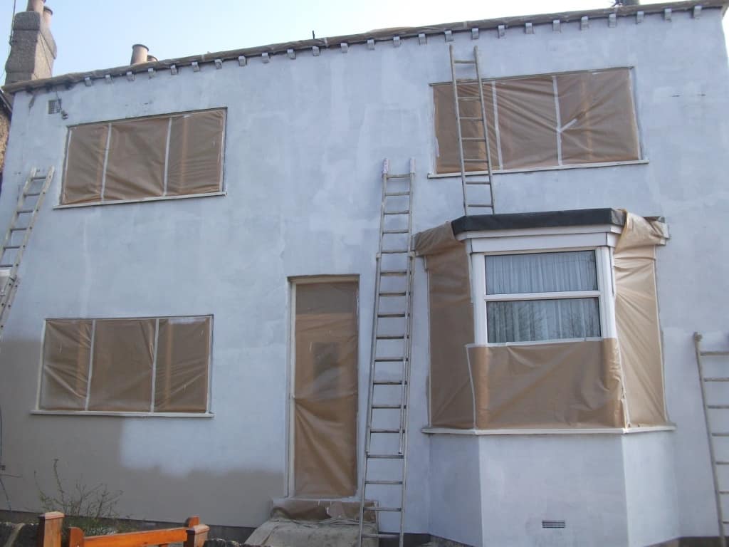 This shows us preparing to apply the textured wall coatings