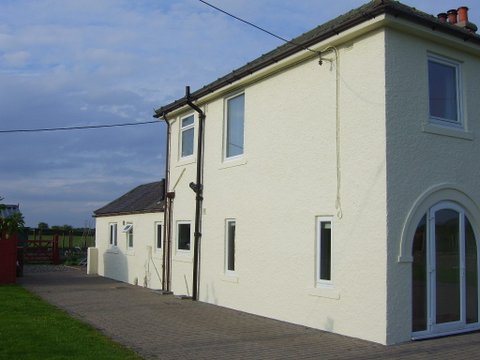 A view of the completed job, front and side textured wall coating