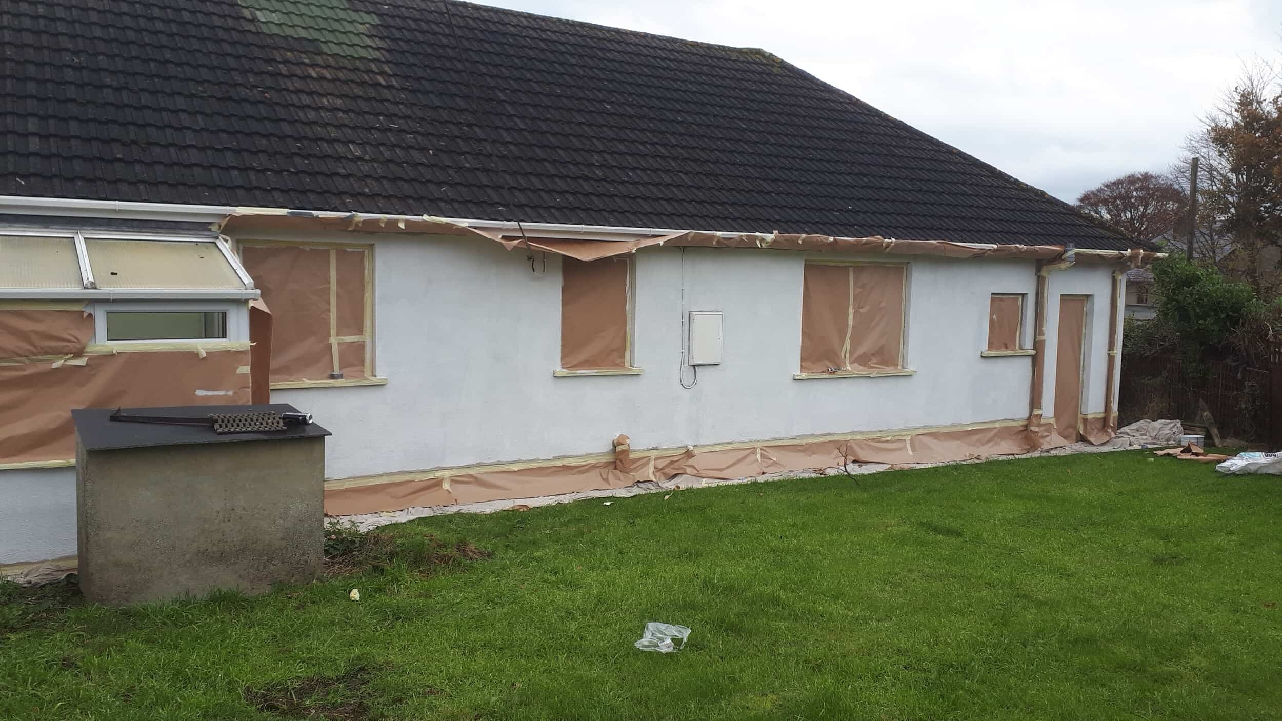 Primer coating on a masked up wall prior to the application of a textured wall coating