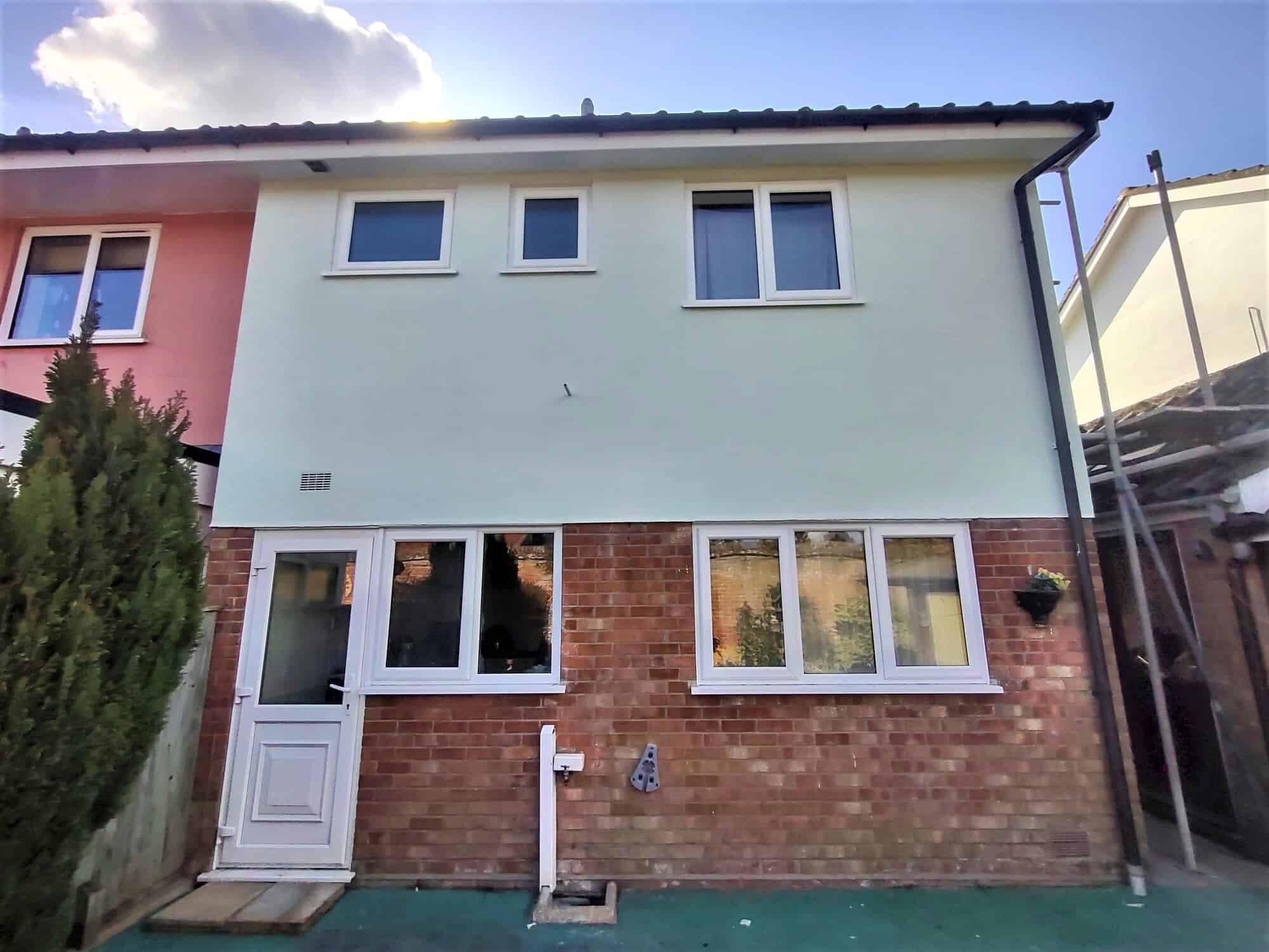 Repainting the top half of a house with rendered walls