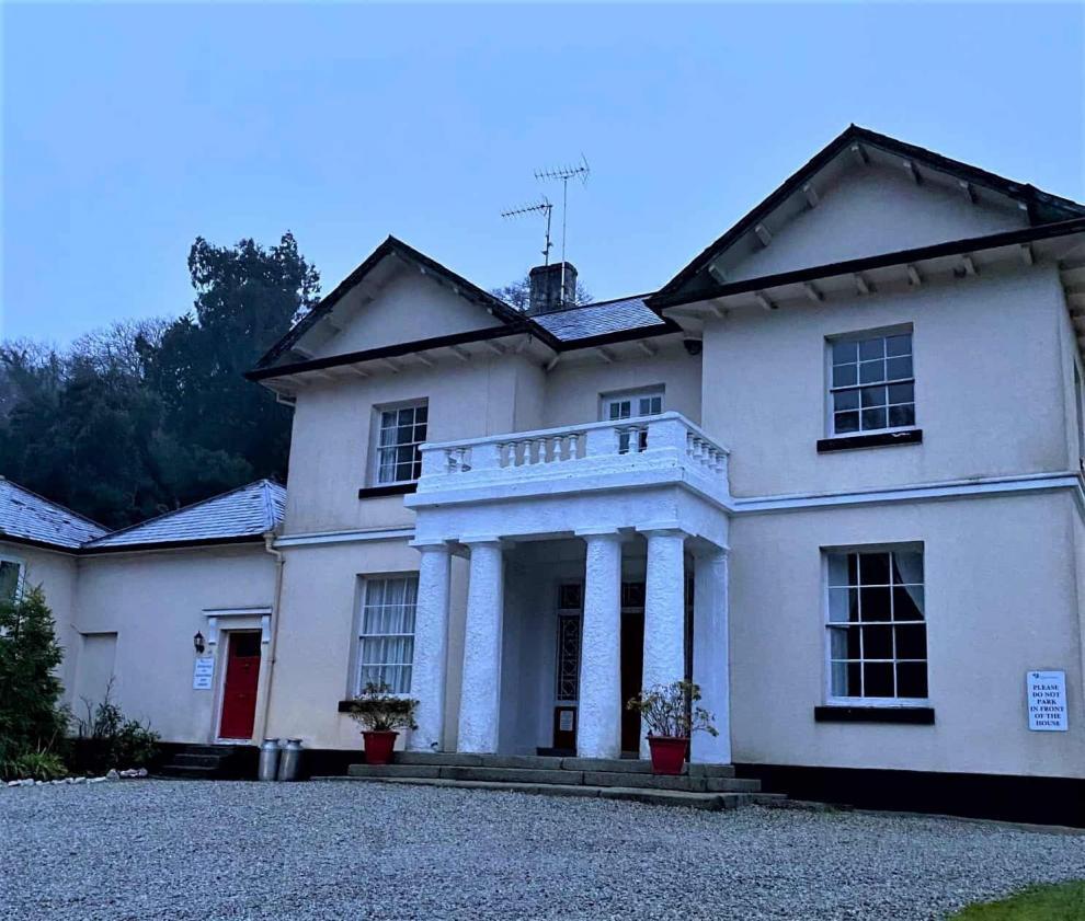 front of cornish manor house before wall coating work started