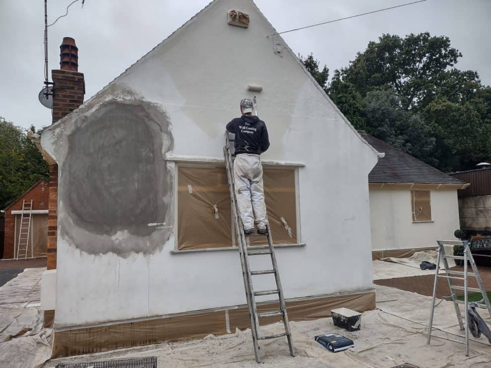 gable end repaired render patch and applying primer coating